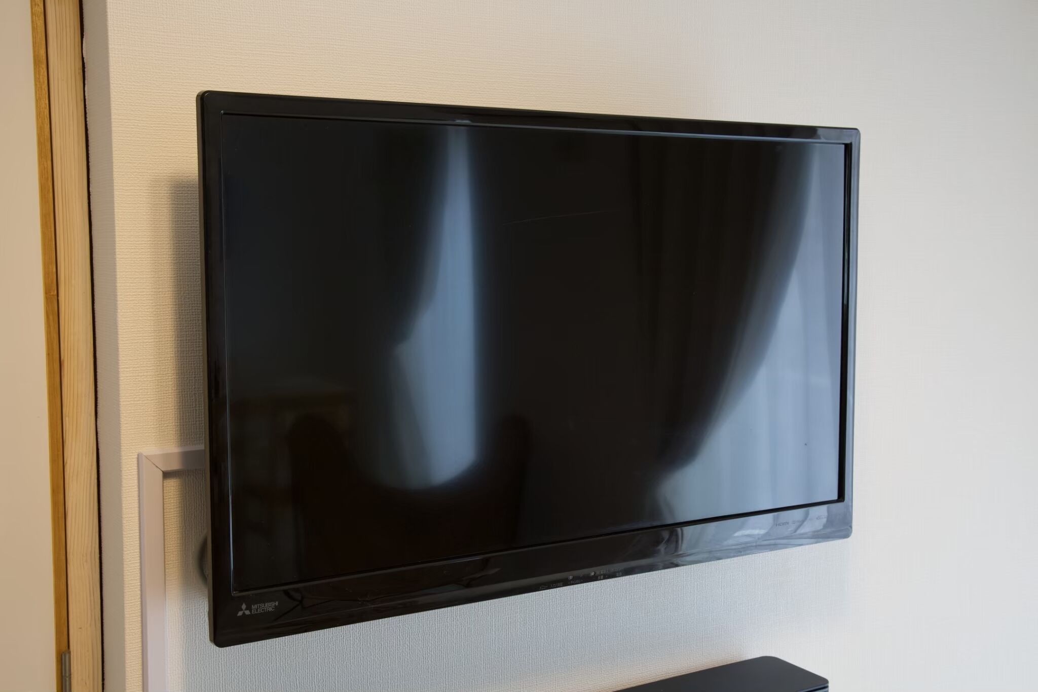 A flat-screen TV mounted on a wall.