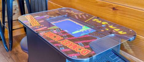 A retro arcade machine with colorful graphics and a joystick.