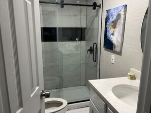 Shower, hair dryer, towels, soap