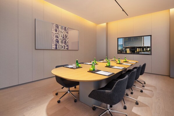 A conference room with a long table, chairs, and a large abstract painting on the wall. - Pagoda Hotel, Baoan,qianhai, Shenzhen (Shenzhen)