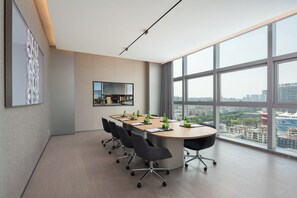 A modern conference room with a large table, chairs, and a city view through large windows. - Pagoda Hotel, Baoan,qianhai, Shenzhen (Shenzhen)