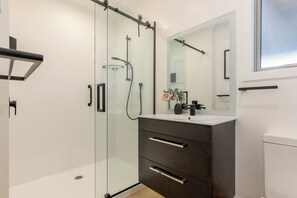 Shower, hair dryer, towels, soap