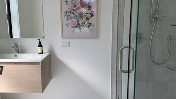 Shower, towels, soap, toilet paper