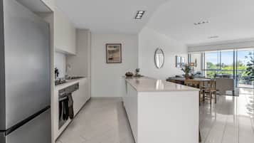 Luxury Apartment, Balcony, Park View | Private kitchen | Fridge, microwave, oven, stovetop