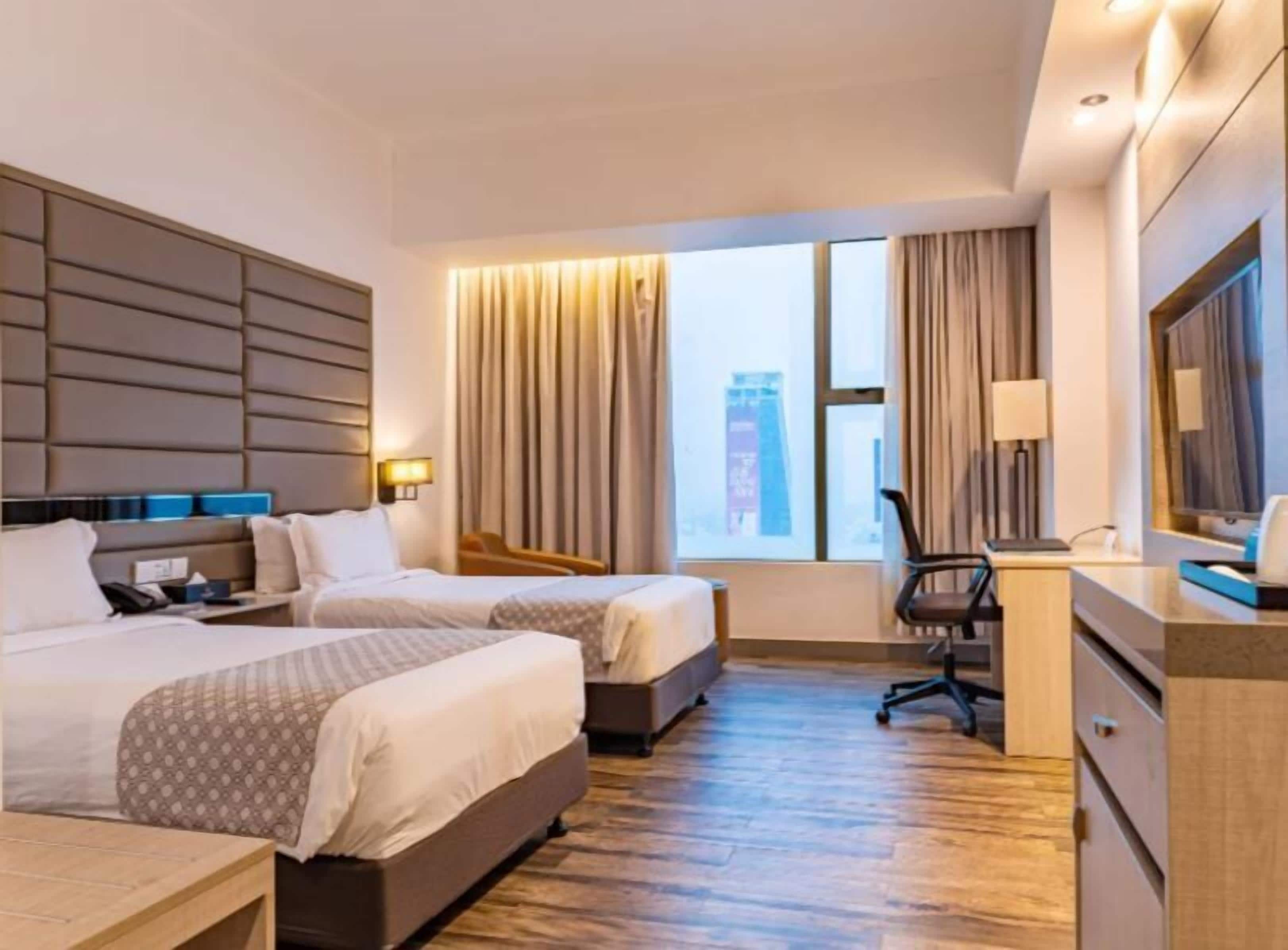 Deluxe Double or Twin Room, City View | Premium bedding, down comforters, memory foam beds, desk