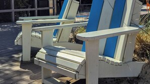 Two Adirondack chairs on a wooden deck with a clear blue sky and a wooden structure in the background. - Casa Mar - Beachside Bliss.
Sun, sand and family fun All in one place. (Carrum)