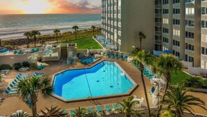 A hotel with a pool, beach view, and multiple floors. - Beach Front Ocean Front Condo Top of the Gulf 516 (Panama City Beach)