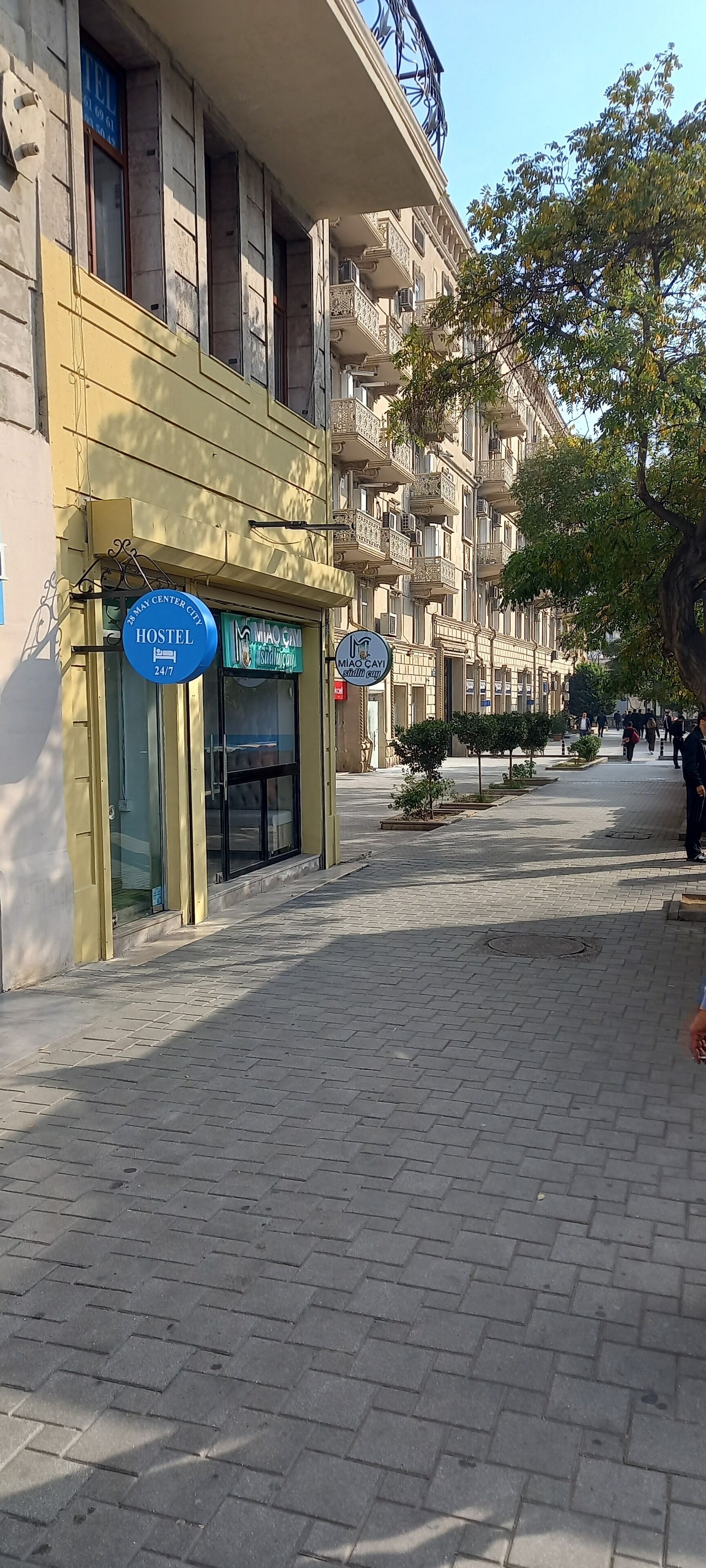A hostel with a sign indicating it is family-friendly and open 24/7.