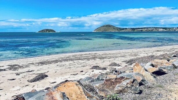 A beach with clear water, rocky foreground, and distant islands. - Bayview Encounter - Sea and island views in luxury incl breakfast and linen. (Encounter Bay)