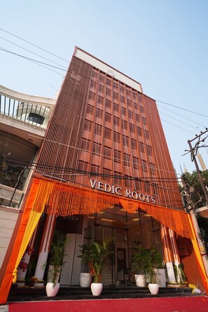 A building with a sign reading "Vedic Roots". - Hotel Vedic Roots (Varanasi)
