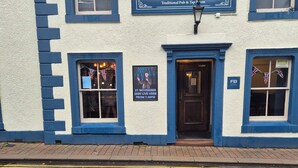 A traditional pub with a sign reading "The Old Victoria" and a date for an event. - The Old Victoria (Penrith)