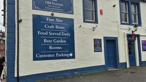 A building with a sign advertising The Old Victoria, a traditional pub and tap room. - The Old Victoria (Penrith)
