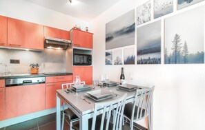 Fridge, stovetop, dishwasher, coffee/tea maker