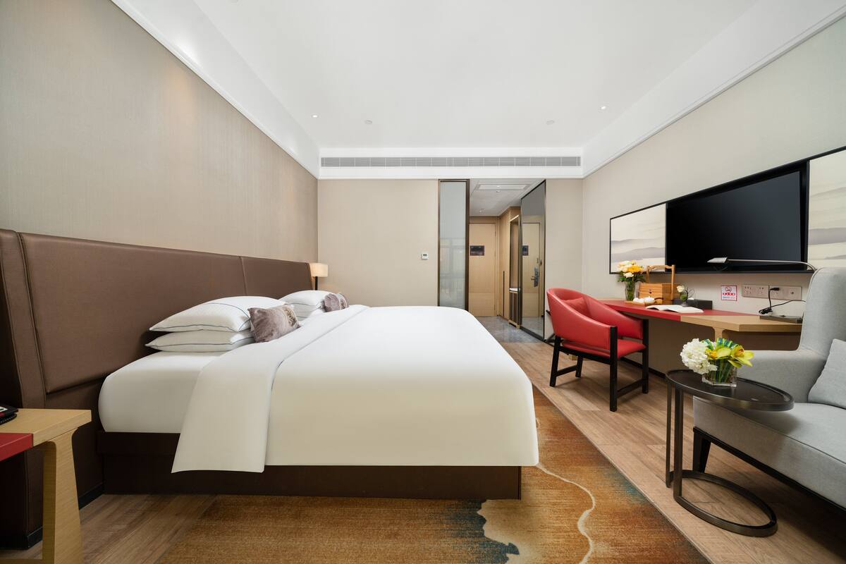 Habitación individual de lujo | Ropa de cama de alta calidad y edredones de plumas