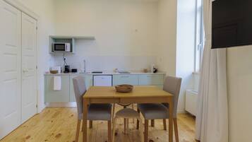 Deluxe Apartment, Balcony, Mountain View | Private kitchen | Highchair