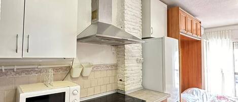 Fridge, microwave, stovetop, coffee/tea maker