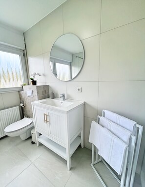 Hair dryer, towels, soap, toilet paper