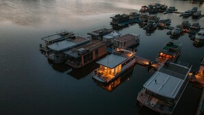 A marina with several houseboats docked. - Havel River Houseboat (Zehdenick)