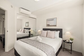 1 bedroom, laptop workspace, bed sheets