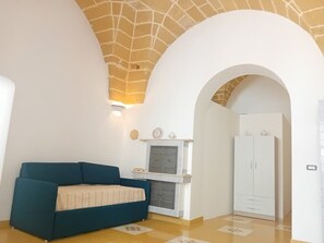 Apartamento conforto, vista para o mar | Área de estar