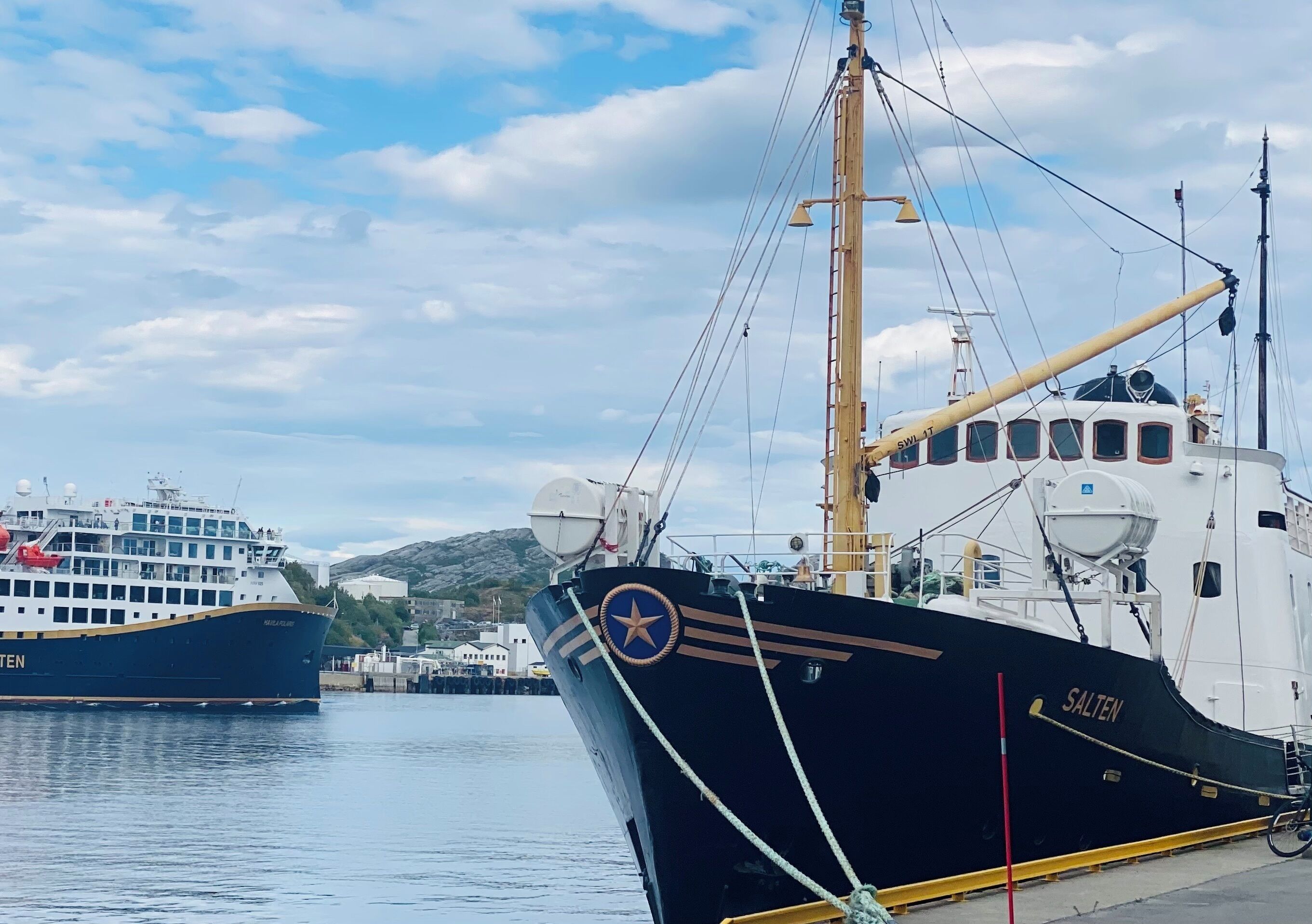 A docked ship with the name 'SALTEN' and a star emblem.