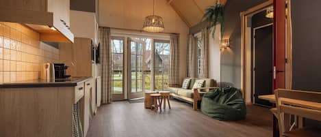 Lodge 6-persons (with unlimited amusement park access) | Living area | 32-inch LED TV with cable channels