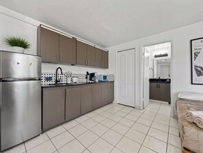Fridge, microwave, stovetop, coffee/tea maker
