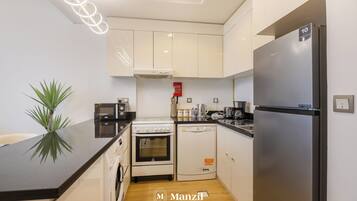 Appartement Luxe, balcon, vue ville | Coin cuisine privé