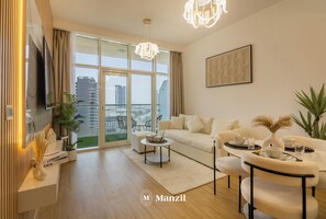 Luxury Apartment, Balcony, City View | Living area - Manzil -1BR w Pool nr Dubai Sports City  (Dubai)