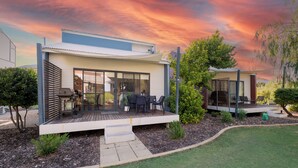 A modern two-story house with a covered patio, a deck, and a small garden area. - "Serenity & Sea", Pool, Wi-Fi, Internet, Netfilix/Stan, 500m to Beach, Parking (Preston Beach)