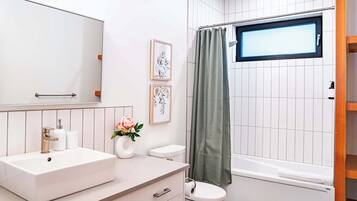 Shower, hair dryer, towels, shampoo