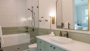 Shower, hair dryer, towels, shampoo