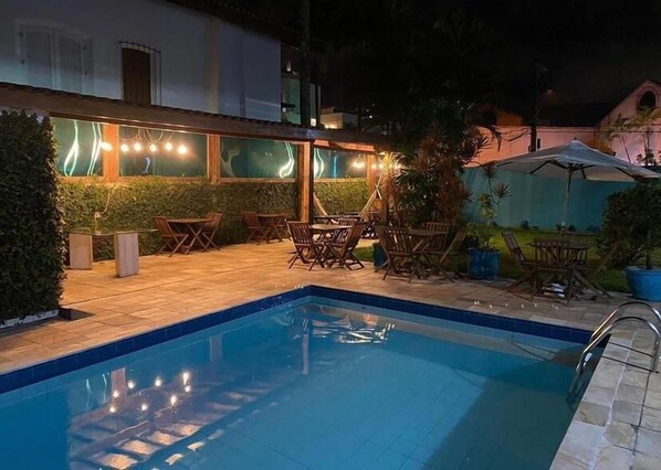 Outdoor pool, open 10:00 AM to 10:00 PM, pool loungers