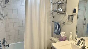 Shower, hair dryer, towels, shampoo