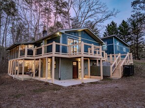 A two-story house with a balcony and a staircase leading to a second level. - Rustic Escape:Indoor Pool|Hot Tub|WiFi|8 Min to PF (Sevierville)
