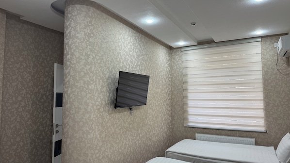 Deluxe Triple Room, Courtyard View | In-room safe, desk, free WiFi, wheelchair access