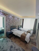 Standard Suite, City View | In-room safe, desk, laptop workspace, blackout drapes