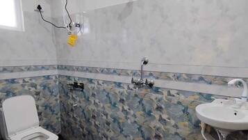 Deluxe Double Room, City View | Bathroom | Shower, towels, soap, toilet paper