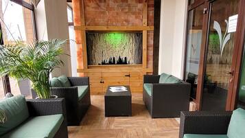 Indoor pool, open 8:00 AM to 10:00 PM, pool loungers, lifeguards on site