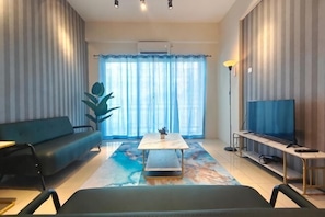 A living room with a sofa, a coffee table, a TV, and a large window with curtains. - Pavilionvillie M1T584 by Irainbow (Kinta)