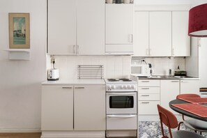 Standard Apartment, Courtyard View | Private kitchen - 1BR Demure Design & Urban Living in Kamppi (Helsinki)