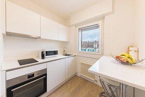 Departamento, balcón, vista a la ciudad | Cocina privada