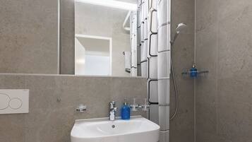 Apartment, Balcony, City View | Bathroom | Soap, toilet paper