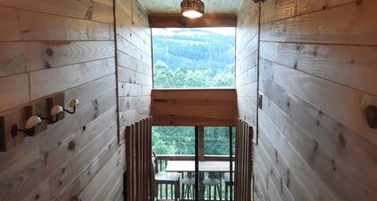 Chalet perched between river and lake