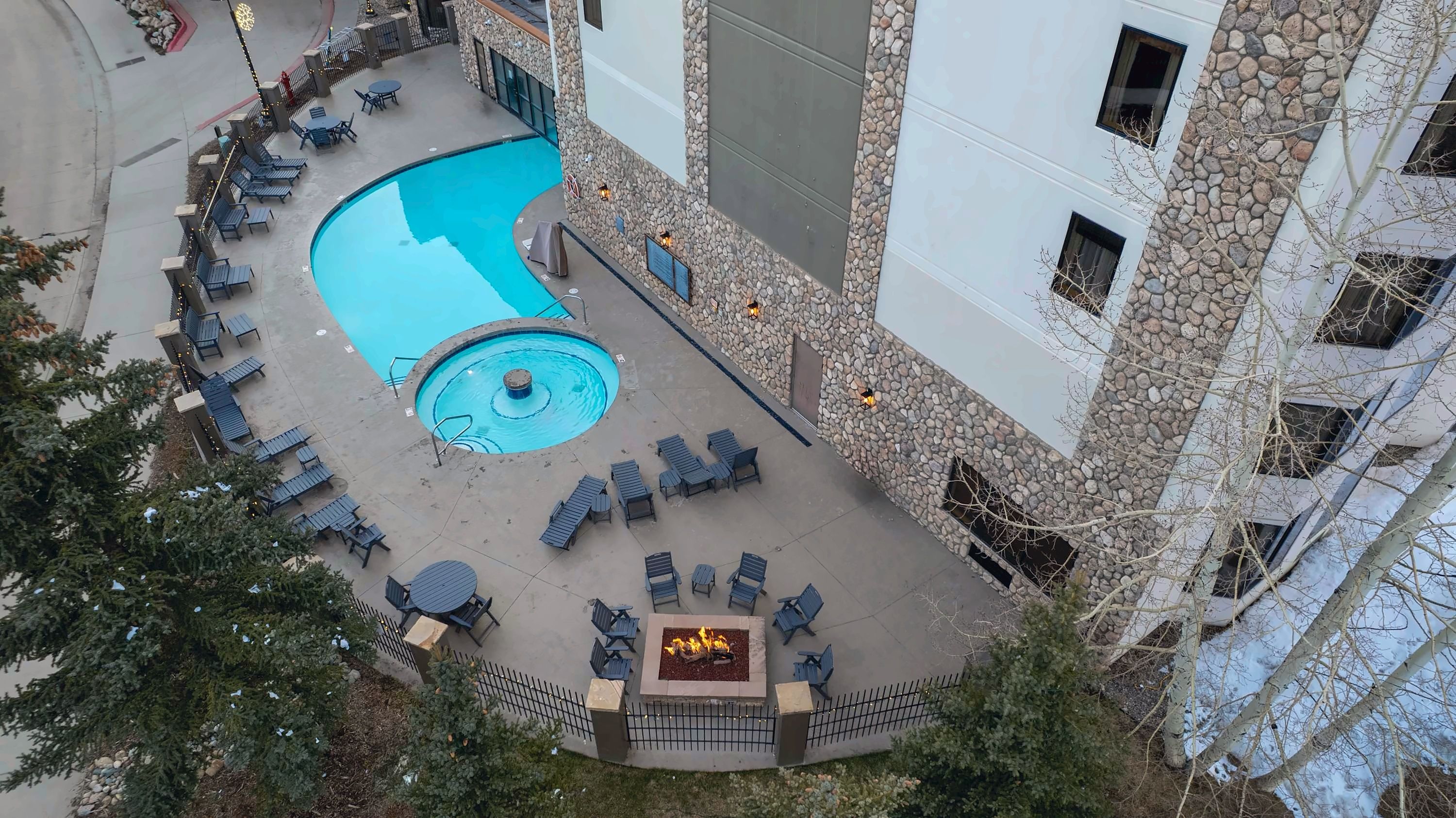 【Aerial】The heated pool and Grand Lodge from above — base-area setting
Listed with @BookTraverse