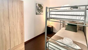 Family Apartment, 4 Bedrooms | Laptop workspace, iron/ironing board, free WiFi