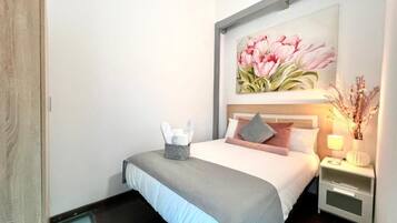 Family Apartment, 4 Bedrooms | Laptop workspace, iron/ironing board, free WiFi