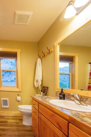 Regadera, secadora de cabello, toallas