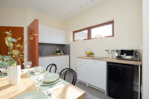 Fridge, microwave, stovetop, cookware/dishes/utensils