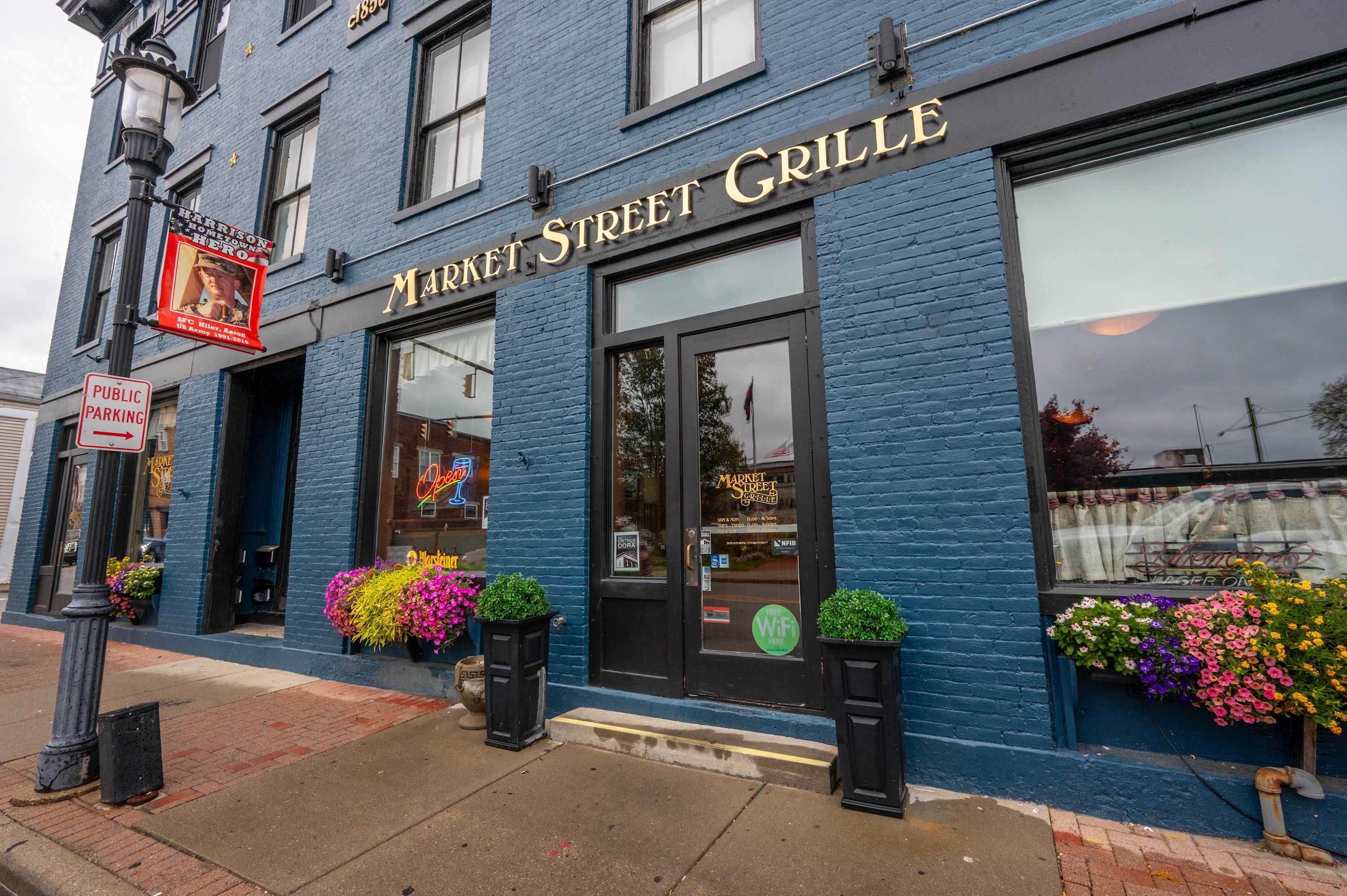 A blue building with a sign reading "Market Street Grille".